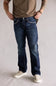 Ariat M5 Slim Stretch Coltrane Straight Leg Jeans for Men; Person wearing blue jeans and a brown shirt on a plain background