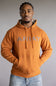 Ariat Stitch Shield Logo Hoodie for Men in Adobe Orange