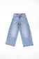 Light wash blue denim jeans laid flat on a white background.