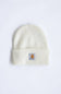 An off-white ribbed knit beanie hat featuring a small Carhartt brand patch on the front cuff, set against a plain white background.