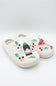 front profile of a white slipper featuring festive holiday drinks