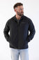 man standing in front of a white background looking off to the side in a patagonia jacket