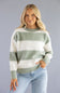 Front view of a blonde woman wearing the Pink Rose cream and sage green horizontal striped crew neck sweater styled with light-wash jeans.