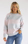 Front view of a blonde woman wearing the Pink Rose light pink and heather grey horizontal striped crew neck sweater, styled with denim jeans.
