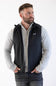 Patagonia Men's R1 Vest in Black styled over a heather grey quarter-zip sweater and dark jeans