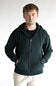 A man wearing a dark forest green zip-up hoodie over a black t-shirt and off-white trousers, standing against a plain light gray background.