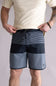 Person wearing black and gray striped shorts on a plain background. The shorts are the Quiksilver SurfSilk Tijuana 19" Boarshorts for Men in Black