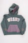 Front view of a girls' gray pullover hoodie featuring patterned applique lettering that spells “WRSHP” across the chest, a pink and navy striped kangaroo pocket, a striped lined hood, and embroidered text on the sleeve cuffs reading “Live With Grace” and “Serve With Joy” against a plain light background.