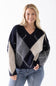 Blonde woman modeling a stylish argyle sweater
