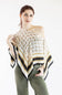 A woman modeling a white scarf with a repeating gold monogram pattern and striped borders in black, navy, and gold, styled over her shoulder.