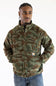 Front view of a male model wearing a full-zip fleece jacket featuring an Army Green camouflage pattern with the Carhartt logo patch on the left pocket.