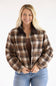 Model wearing the Brown and Cream Plaid Barn Jacket with a dark brown corduroy collar, featuring a relaxed fit, front zipper, and long sleeves.