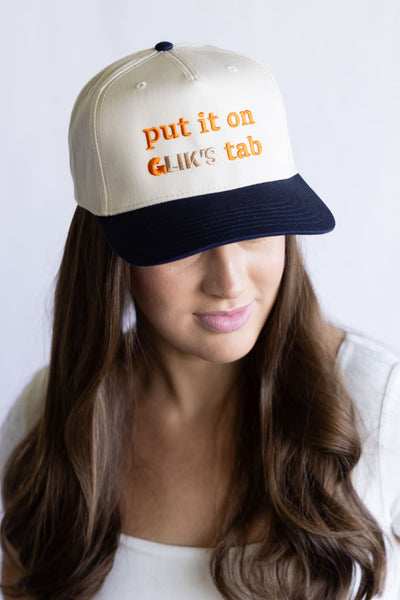 Put It On Glik's Tab Trucker Hat for Women in Navy/Tan