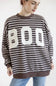 A woman posing in a brown and white horizontally striped sweatshirt with a large white BOO graphic on the front, paired with light blue jeans, against a plain white background.
