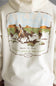 Close-up of the back of an off-white hoodie featuring a large vintage-style western graphic print with barbed wire, cowboys on horseback, and text reading 'Made to Last Quality Boots and Denim' and 'Since 1993'.