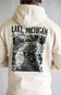 A person shown from the back wearing a cream-colored hoodie with a large black graphic print on the back featuring a map illustration and the text 'LAKE MICHIGAN'.