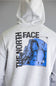 A light heather gray hoodie shown from the back, featuring a large graphic print of a blue mountain scene with 'THE NORTH FACE' text in black.
