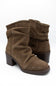 A pair of women's brown suede slouchy ankle boots with a low block heel and a decorative braided trim along the top collar, shown against a plain white background.