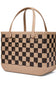 A structured tote bag featuring a black and beige checkerboard pattern with matching beige handles and a beige base, accented by small metallic studs.