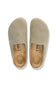 A pair of Birkenstock slip-on clogs in a light taupe suede-like material, shown from a top-down view on a white background.