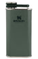 A green Stanley hip flask with a textured finish, featuring the black Stanley logo on the front and a dark green flip-top lid with a silver metal rim.