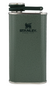 A green Stanley hip flask with a textured finish, featuring the black Stanley logo on the front and a dark green flip-top lid with a silver metal rim.