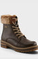 A dark brown leather lace-up ankle boot with a tan faux-fur collar and a chunky lug sole, shown on a light gray background.
