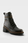 A black leather lace-up ankle boot with a chunky block heel, brown welt stitching, and a decorative brown strap detail near the collar, shown on a light gray background.