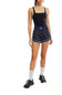 FP Movement Varsity Blues Runsie for Women in Black Combo; Person wearing a black athletic outfit with a white background