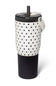 A 32 oz insulated tumbler by Isomate, featuring a white upper body with black polka dots, a black lower section, and a black lid with a clear straw insert and white carry loop, shown on a white background.