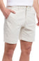 Beige shorts worn by a person on a white background