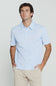 7Diamonds Aires Polo for Men in Light Blue; Man wearing a light blue shirt and beige pants against a plain background