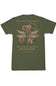 An olive green short-sleeve t-shirt with a detailed graphic on the back. The graphic features a dragonfly made of stained glass flowers and leaves, surrounded by pink and orange wildflowers, with the text 'God turns broken pieces into masterpieces give him your pieces' and 'empty souls.