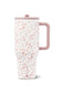 Hydro Flask travel mug with a white background and a delicate pink and orange floral pattern, featuring a dusty pink handle and lid.