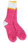A pair of crew socks with a bright pink and white heathered body, a white ribbed cuff with a thin yellow stripe, and a white heel, shown on a plain white background.