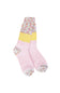 A pair of multicolor patterned crew socks with distinct sections: a multicolor variegated top, a yellow band with white floral motifs, and a light pink lower section with white floral and stripe patterns.