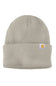 A light beige waffle-knit beanie hat with a small Carhartt logo patch on the front cuff, shown against a plain white background.