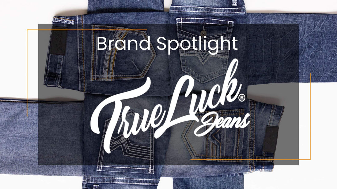 A promotional graphic for True Luck Jeans featuring a flat-lay of folded dark blue denim jeans with a semi-transparent dark overlay and large white script text reading 'Brand Spotlight TrueLuck Jeans'.