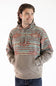 A man wearing a patterned pullover hoodie with a solid tan lower body and front pouch pocket, paired with dark blue jeans, against a plain white background.