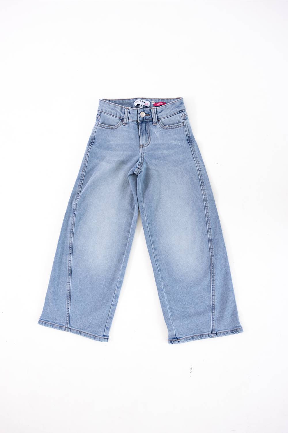 Light wash blue denim jeans laid flat on a white background.