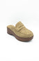 A single taupe suede mule shoe with a brown wooden platform wedge heel, shown from a three-quarters angle on a white background.
