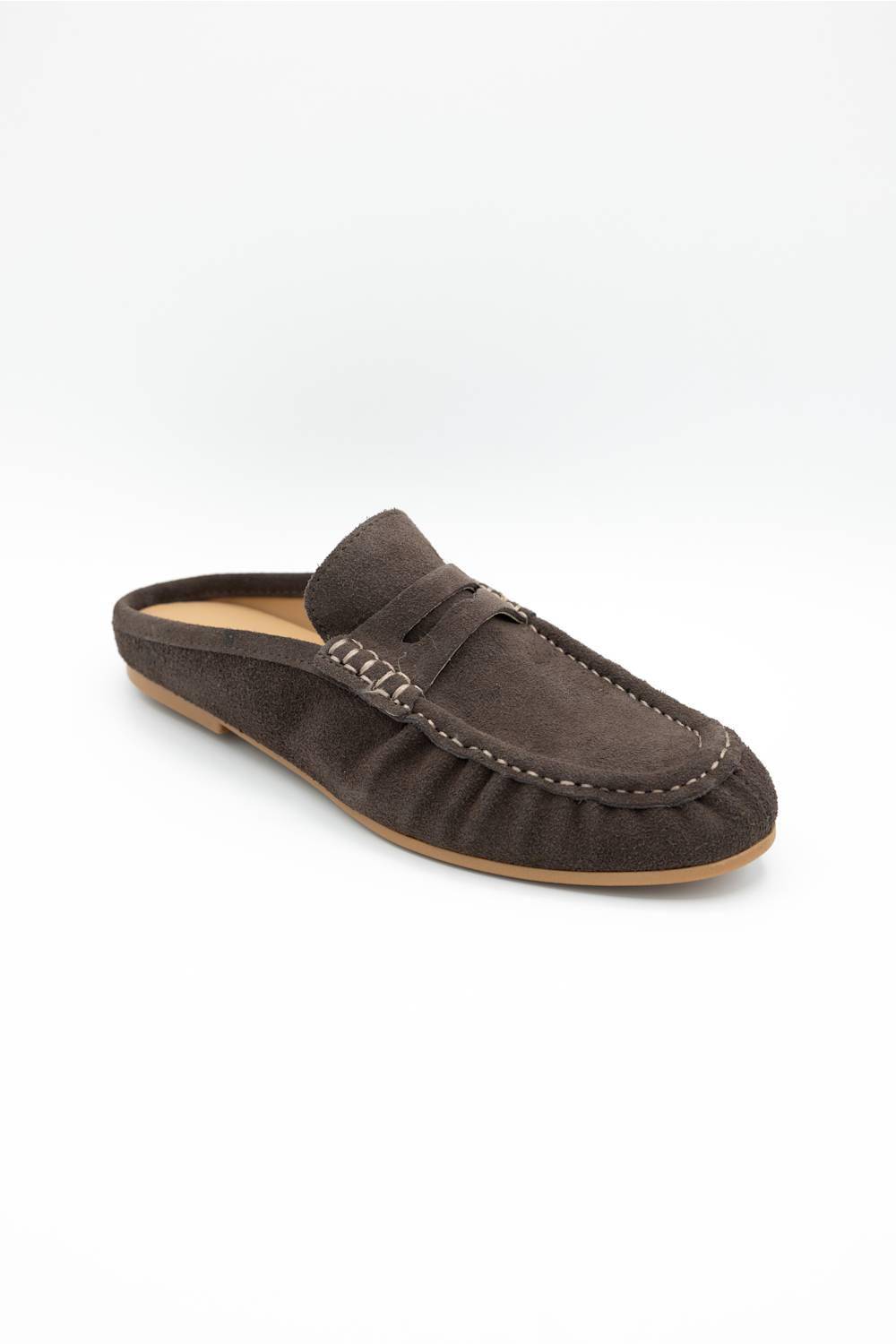 A single dark brown suede mule loafer with a strap across the instep and decorative stitching, shown on a clean white background.