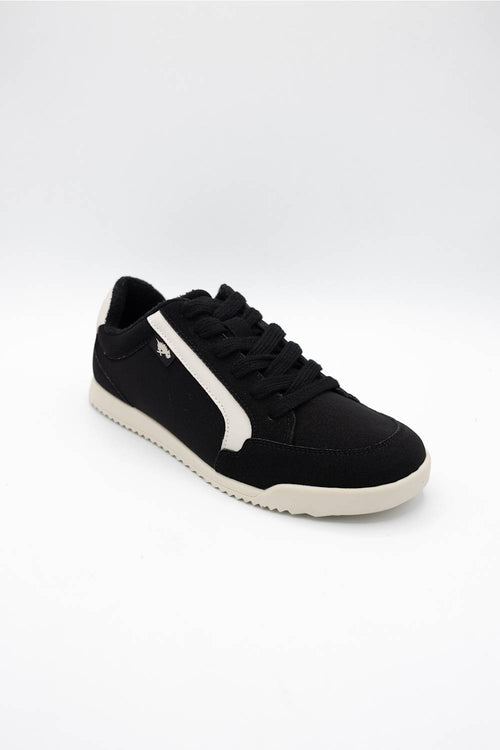 A black low-top sneaker with a white side stripe, black laces, and a white sole, photographed on a seamless white background.