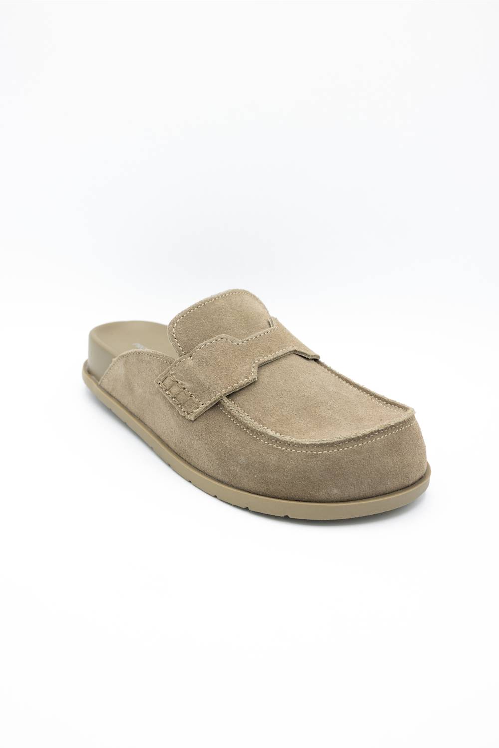 A single taupe suede slip-on clog shoe with a decorative strap across the vamp, shown from a three-quarters angle on a white background.