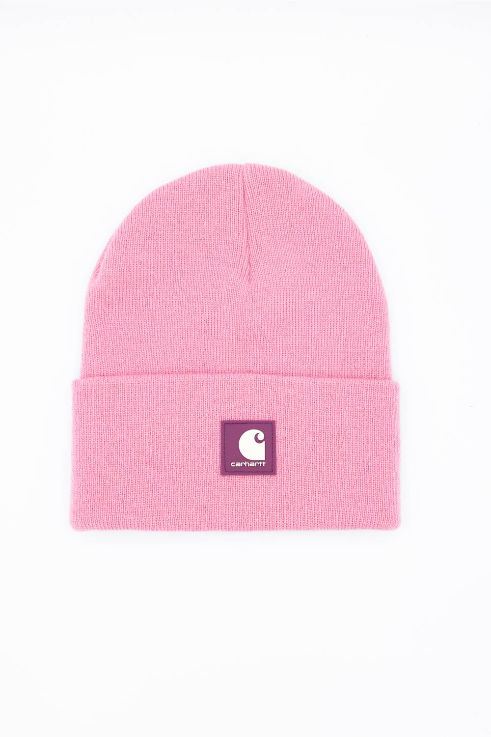 A light pink knit beanie hat with a folded cuff, featuring a small square Carhartt logo patch on the front, set against a plain white background.
