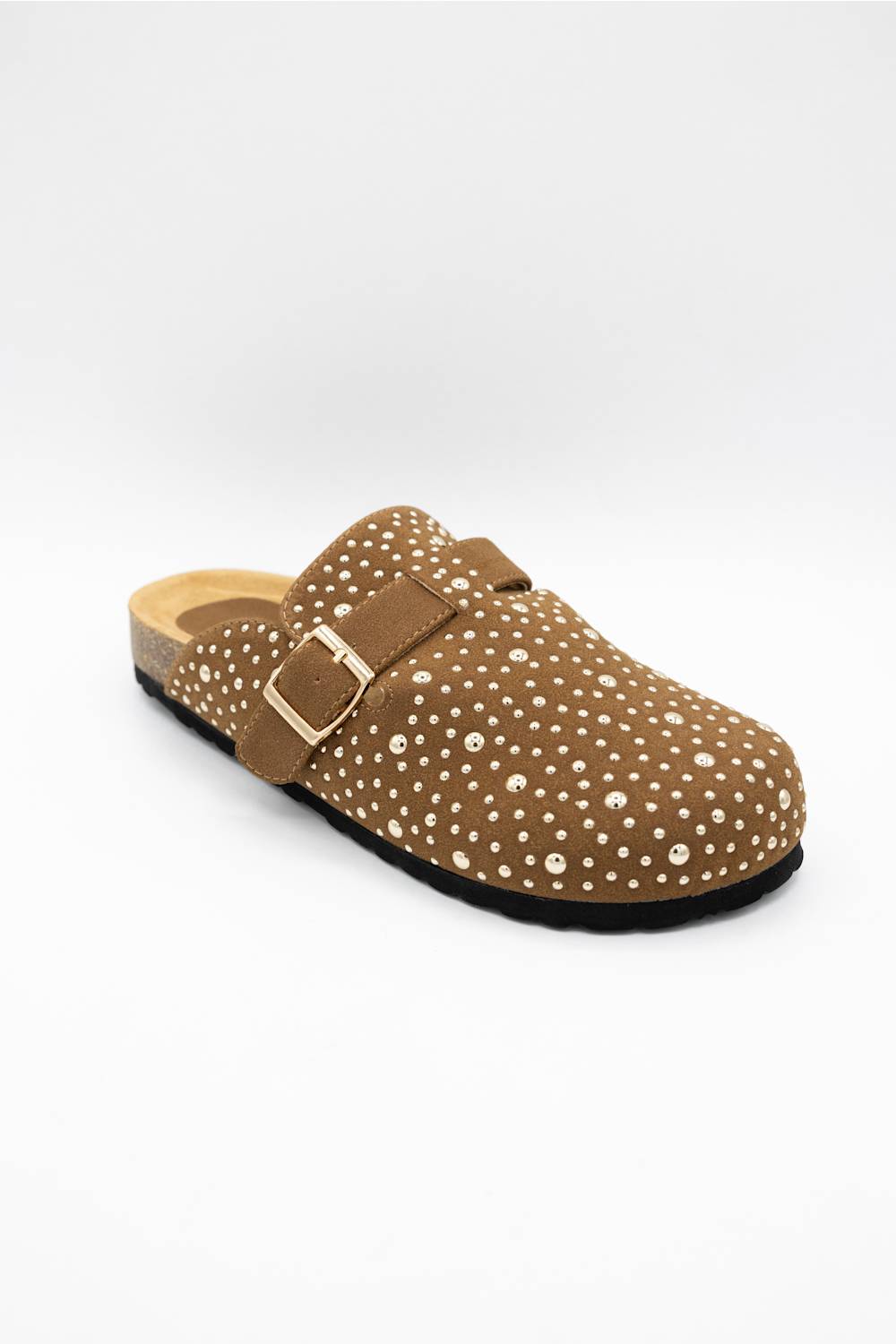 A single brown clog-style mule shoe with a dotted pattern, a wide strap with a gold-tone buckle, and a cork-look midsole, photographed on a light gray background.
