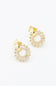 A pair of gold hoop earrings with clear baguette crystals arranged in a sunburst pattern, shown on a plain white background.
