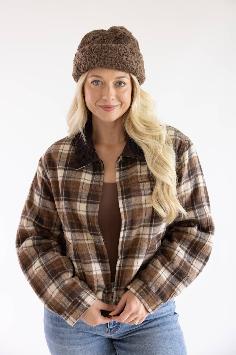 Blonde woman modeling a brown fur fisherman hat 