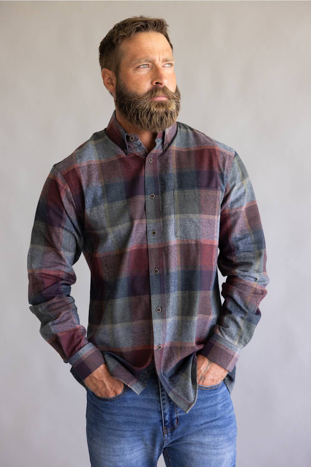 Button down collared flannel shirt in long sleeves, on a blue and red color scheme 
