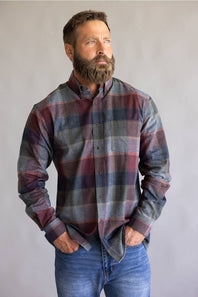 Button down collared flannel shirt in long sleeves, on a blue and red color scheme 